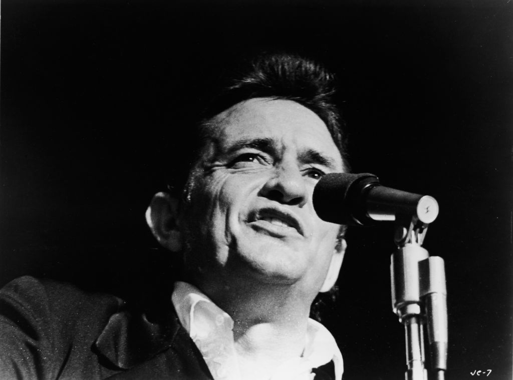 How was johnny cash discount a pose on stage